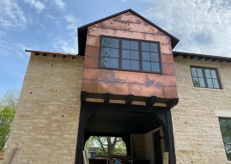 Copper metal panel facade on a stone building for Skylight Installation in Larkspur